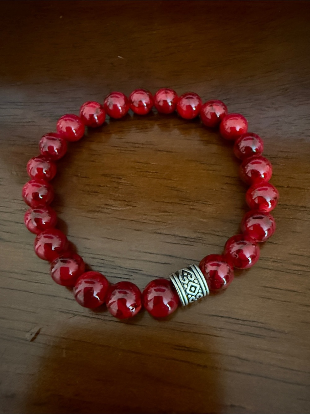 Red Beaded Stretch Bracelet with Decorative Silver Accent